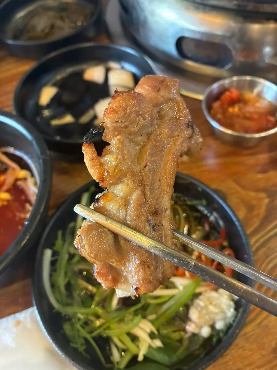 Meat on the grill with kimchi and corn cheese