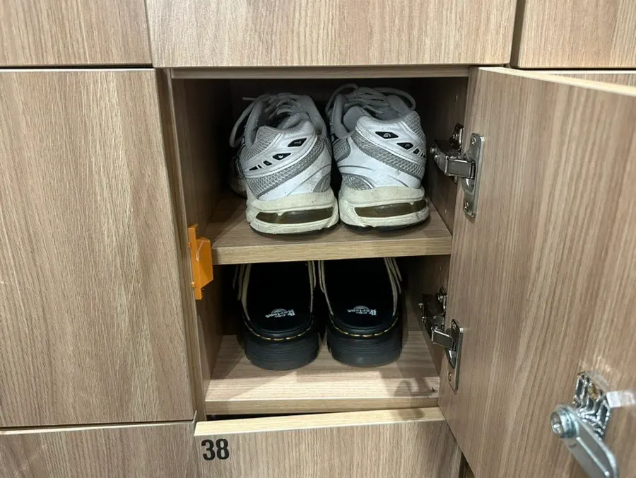 Shoe lockers and slippers at the 2nd floor entrance