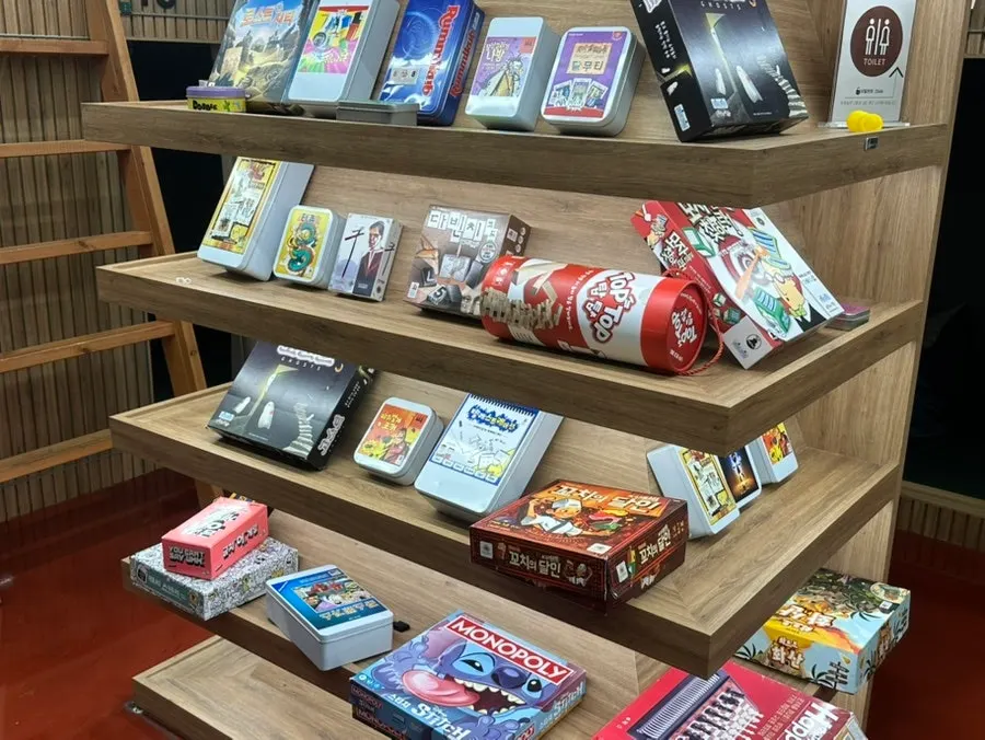 Shelves stocked with a variety of board games