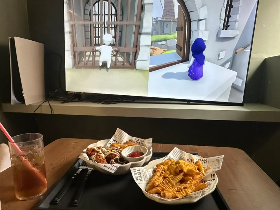 A table enjoying board games alongside food