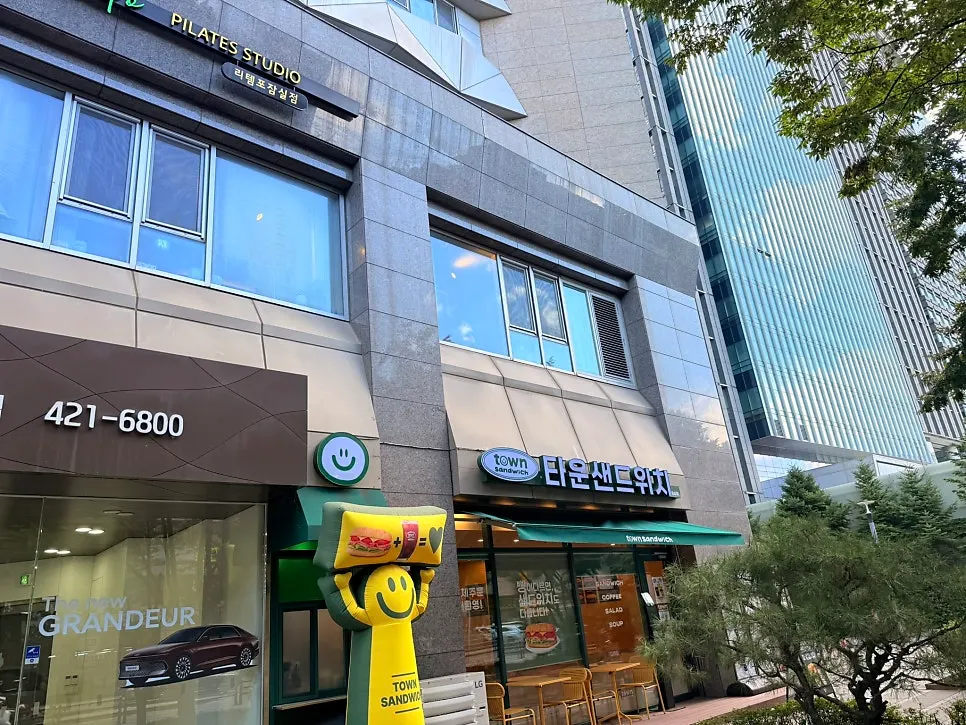 Storefront with the Town Sandwich logo