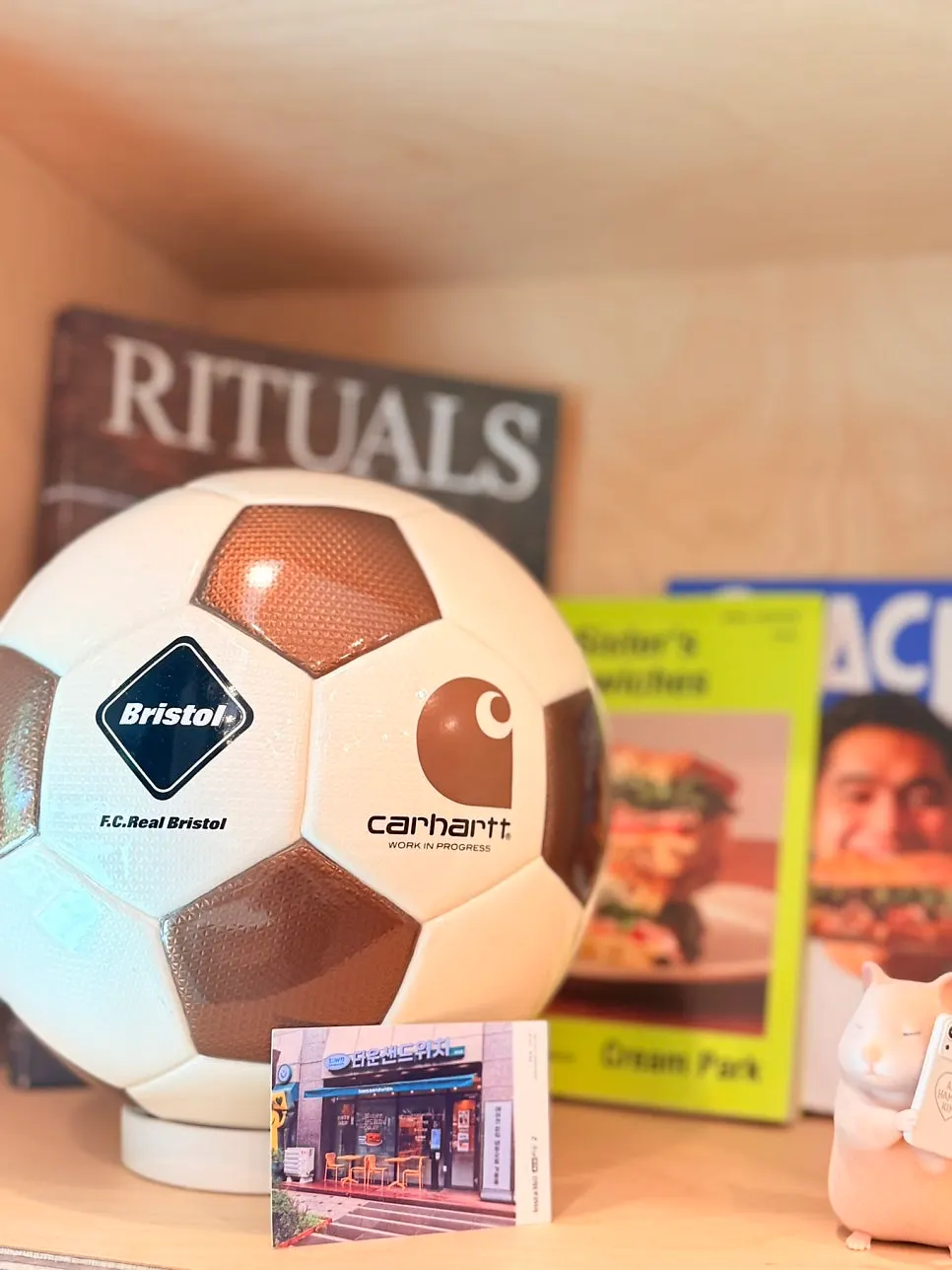 Wall arranged with menu posters and the logo