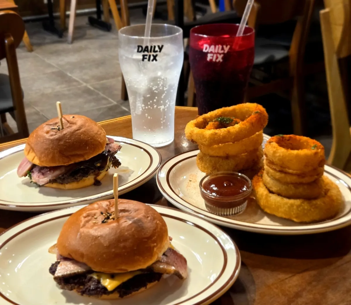 Onion rings and burger dipped in the special BBQ sauce
