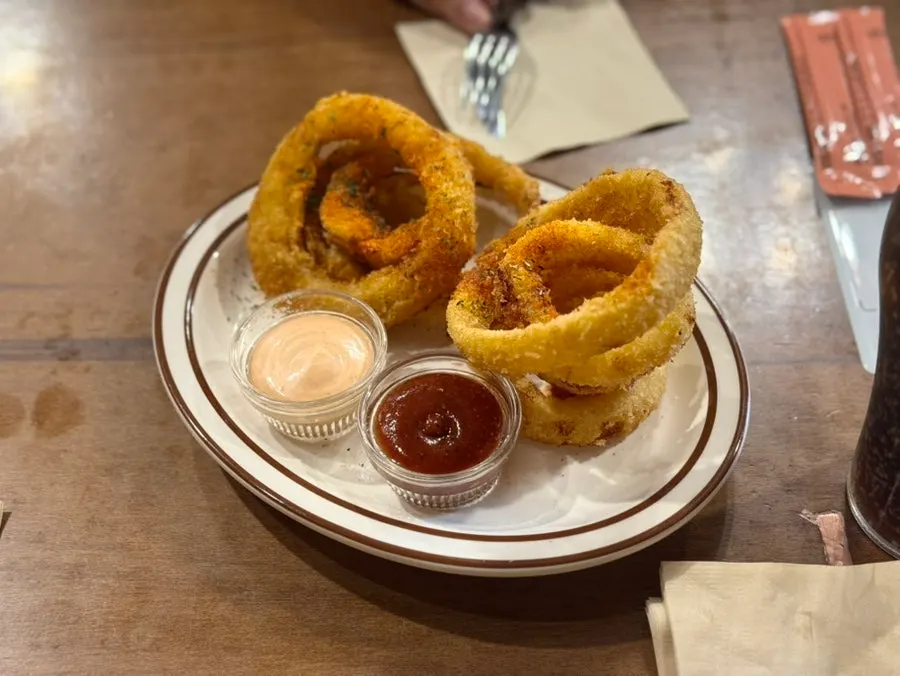 Onion ring dipped in the signature sauce
