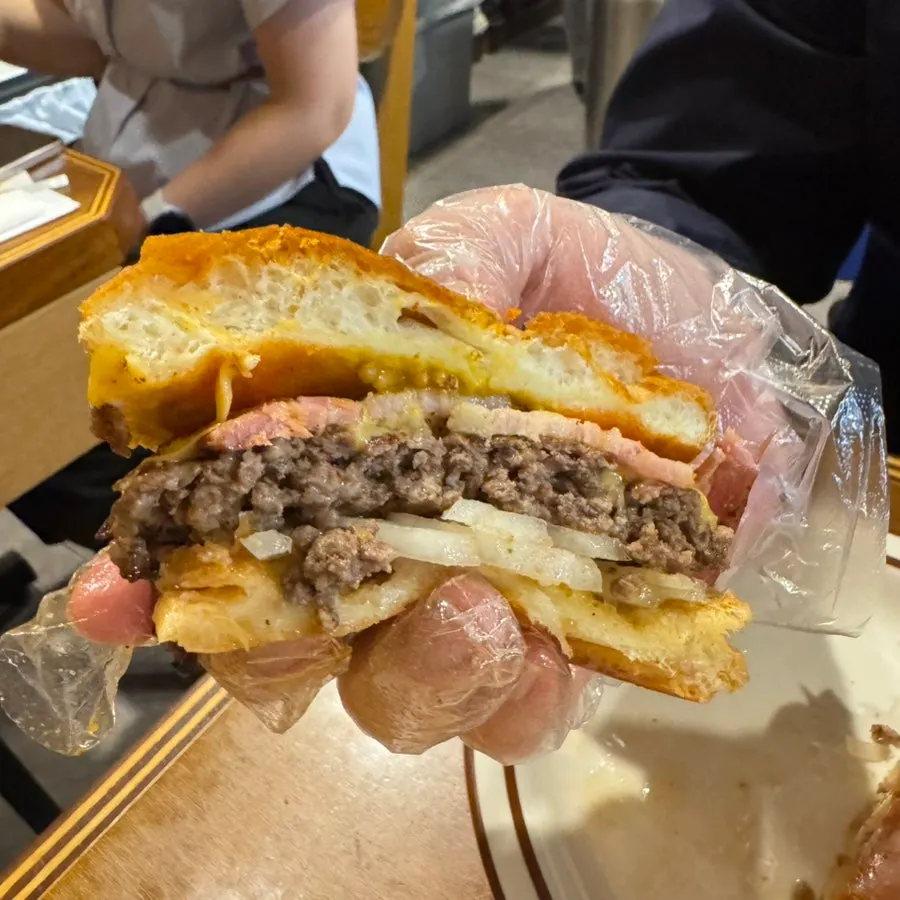 Burger cross-section showing beef, bacon, and cheese