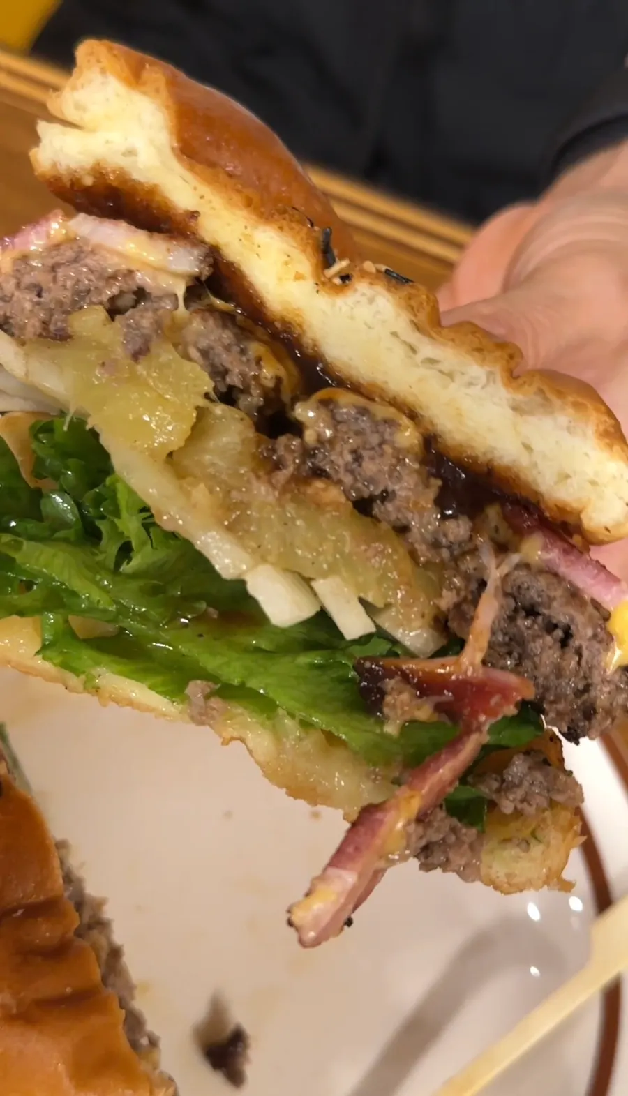 Cross-section of the Hawaiian BBQ burger topped with grilled pineapple