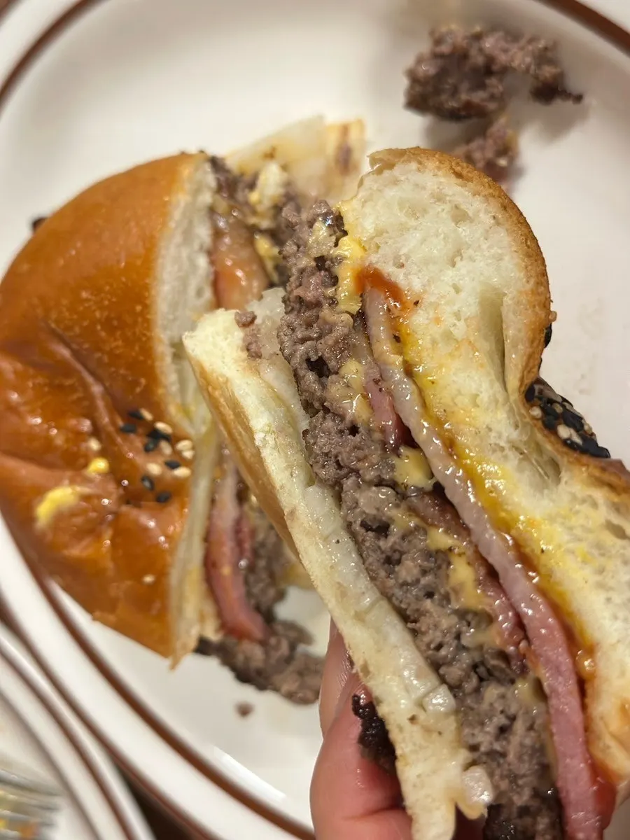 Vertical photo of the signature bacon cheeseburger