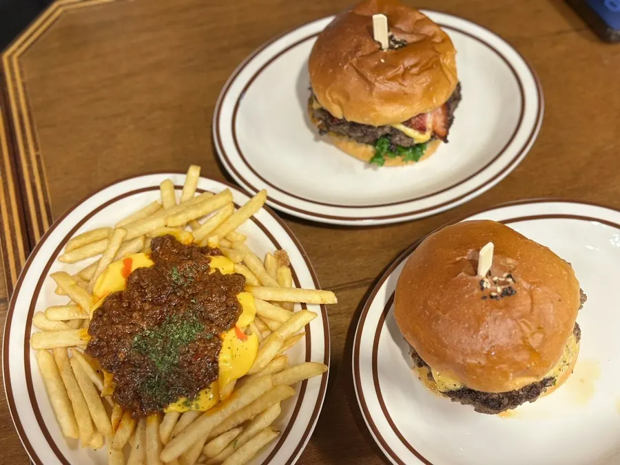 A table with all three burgers