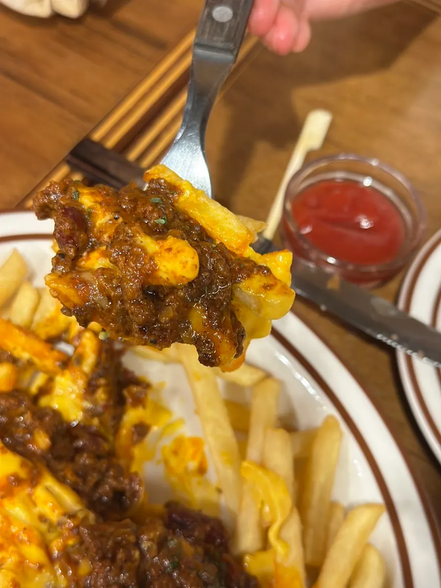 Vertical close-up of chili cheese fries