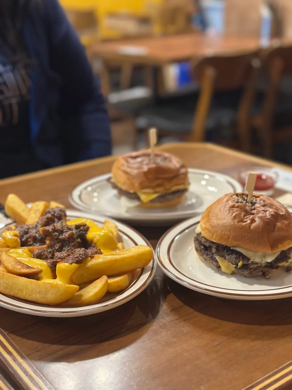 Double cheeseburger and bacon cheeseburger meal spread