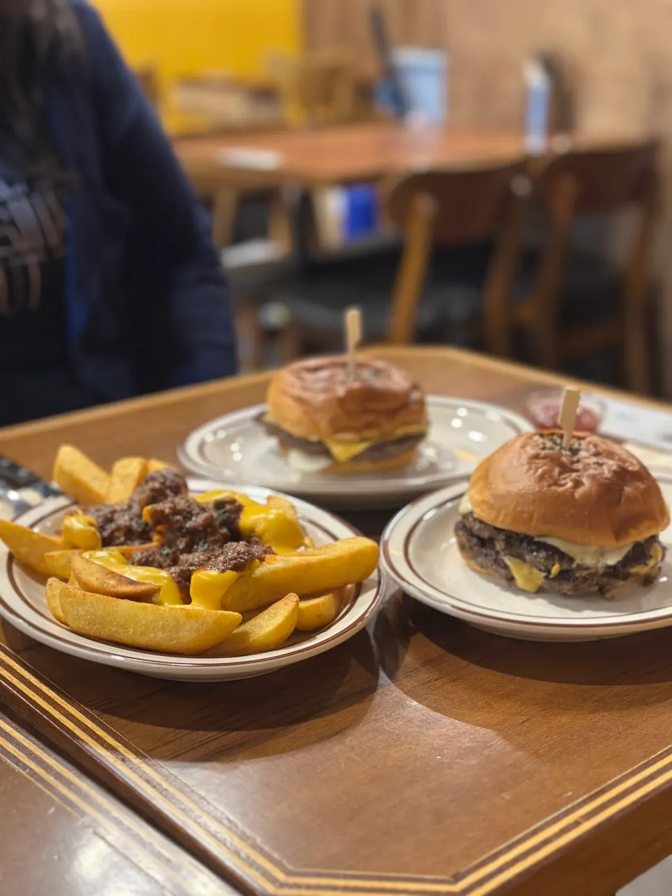 Bacon cheeseburger and side dishes
