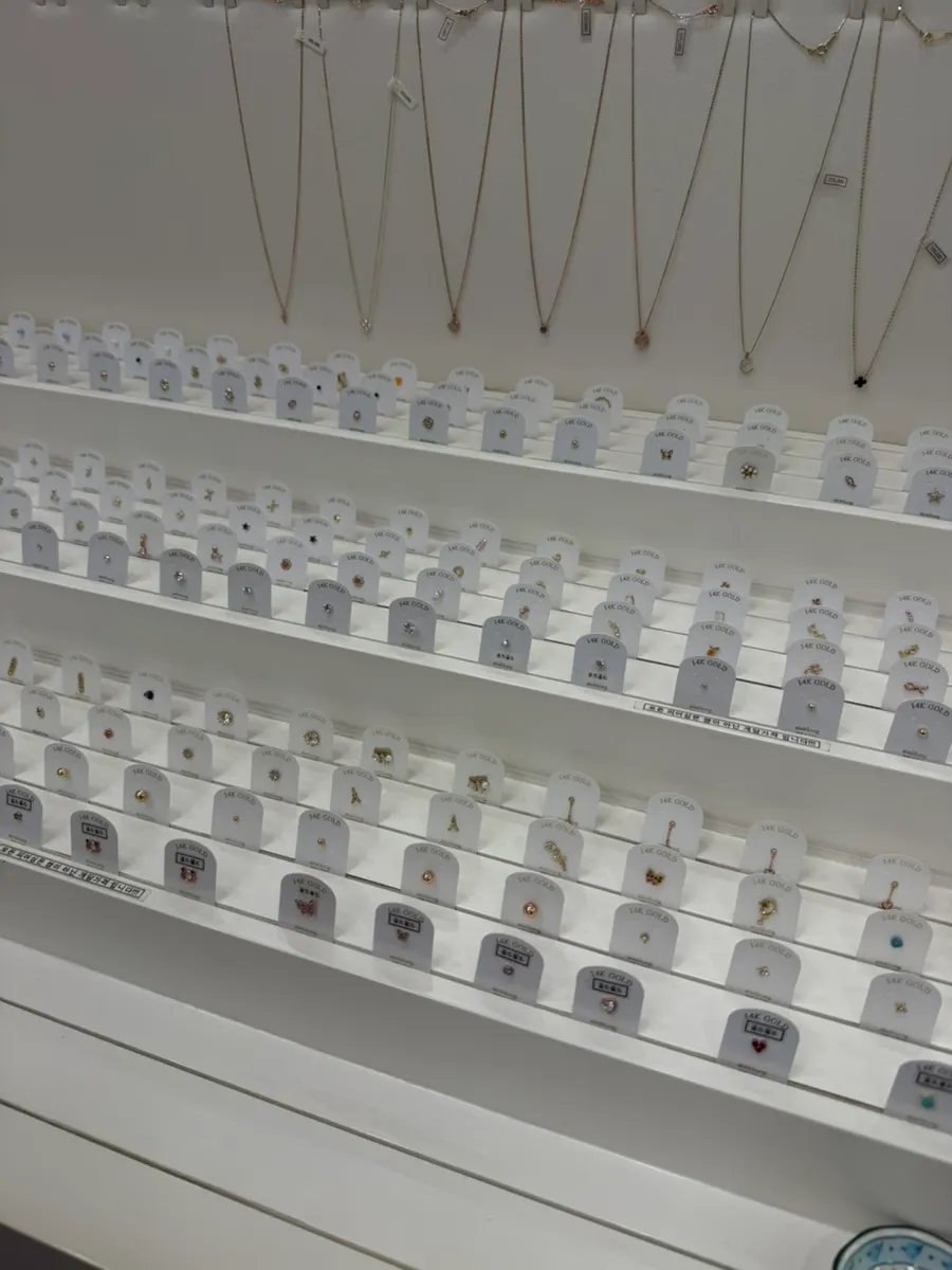 Counter filled with earrings on display