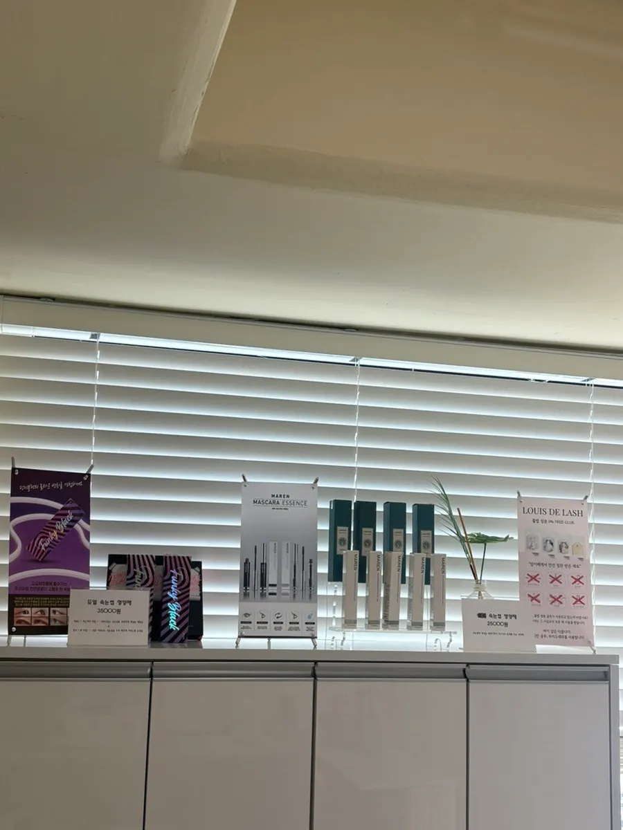 Lash serums displayed behind the counter