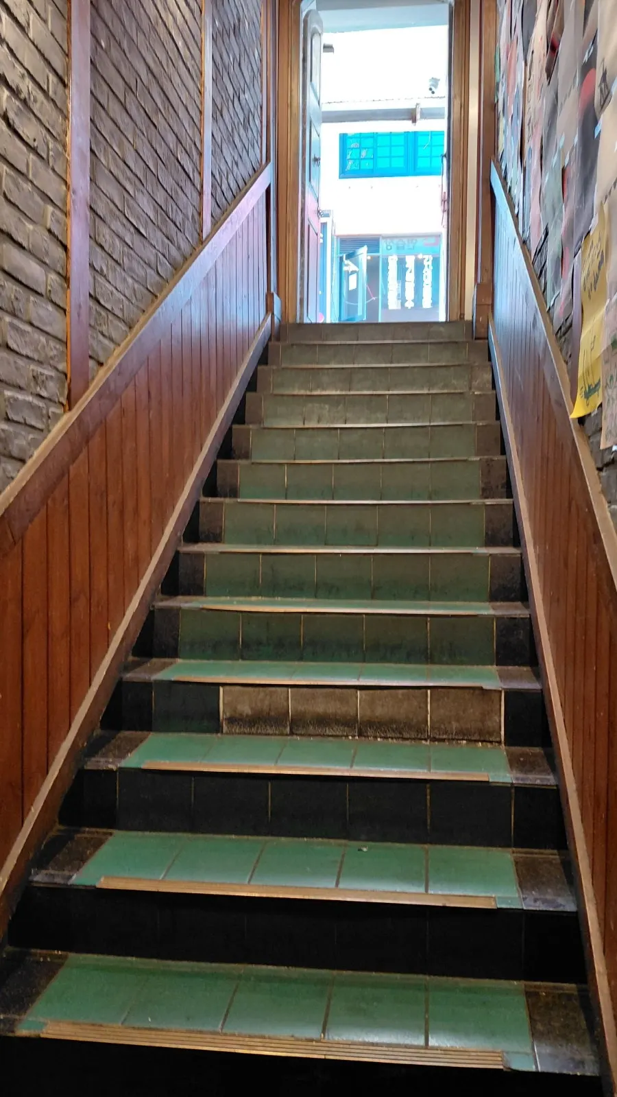 Basement stairs leading to the entrance of Jojomomo