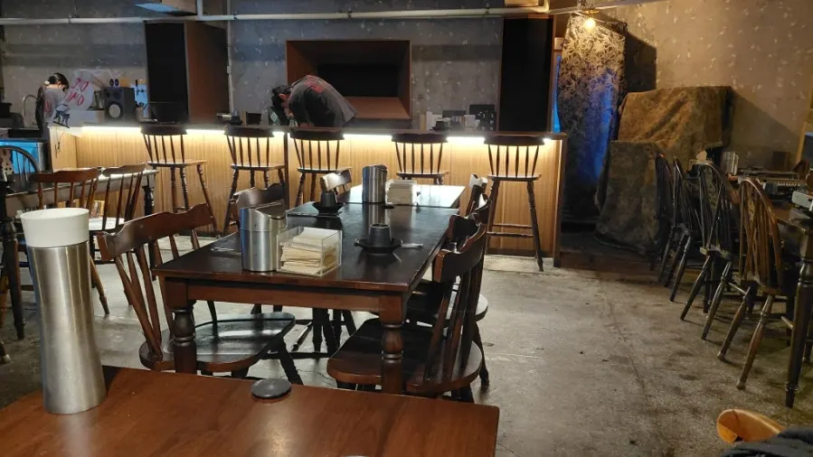 Table with Korean dishes and traditional liquor