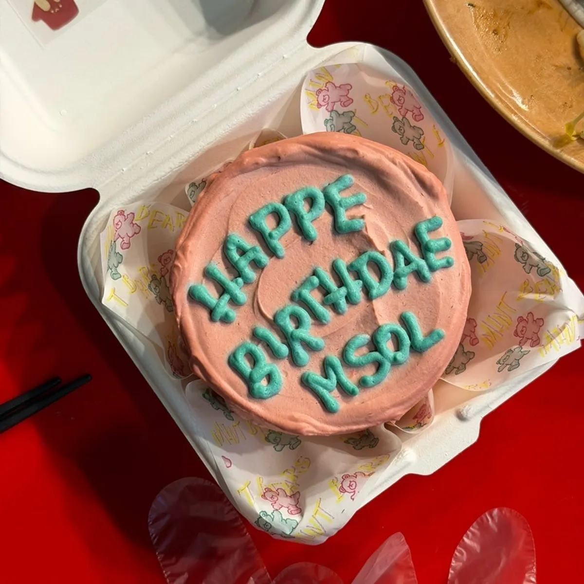 A slice cut from the Oreo lettering cake