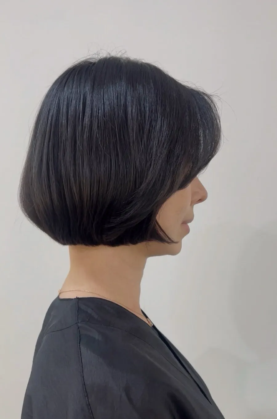 Side view of the light, flowing bob volume perm