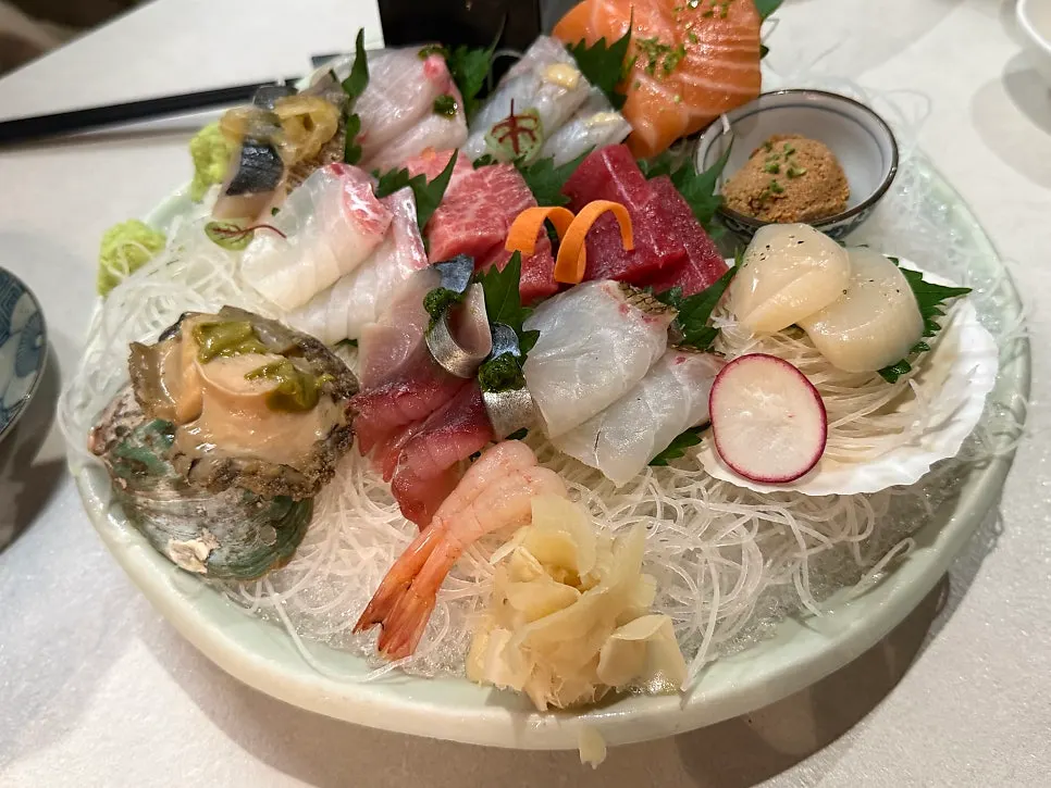 Sashimi for two plated over ice and shaved radish
