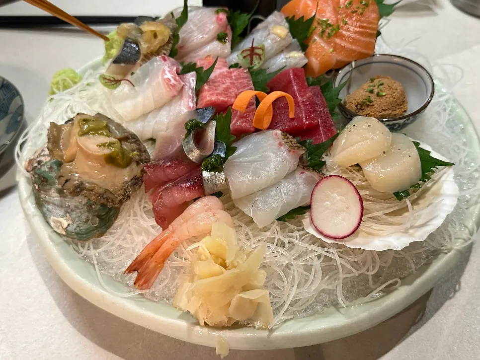 A thick-cut piece of sashimi