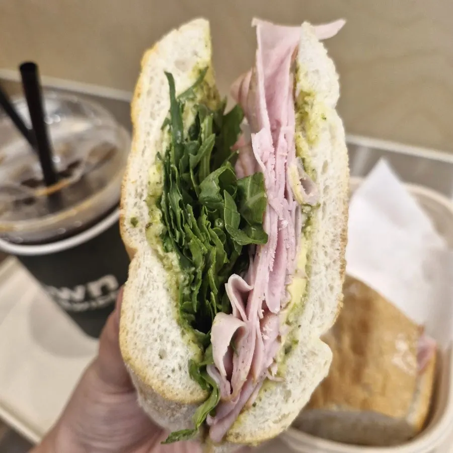 Baguette sandwich with basil sauce