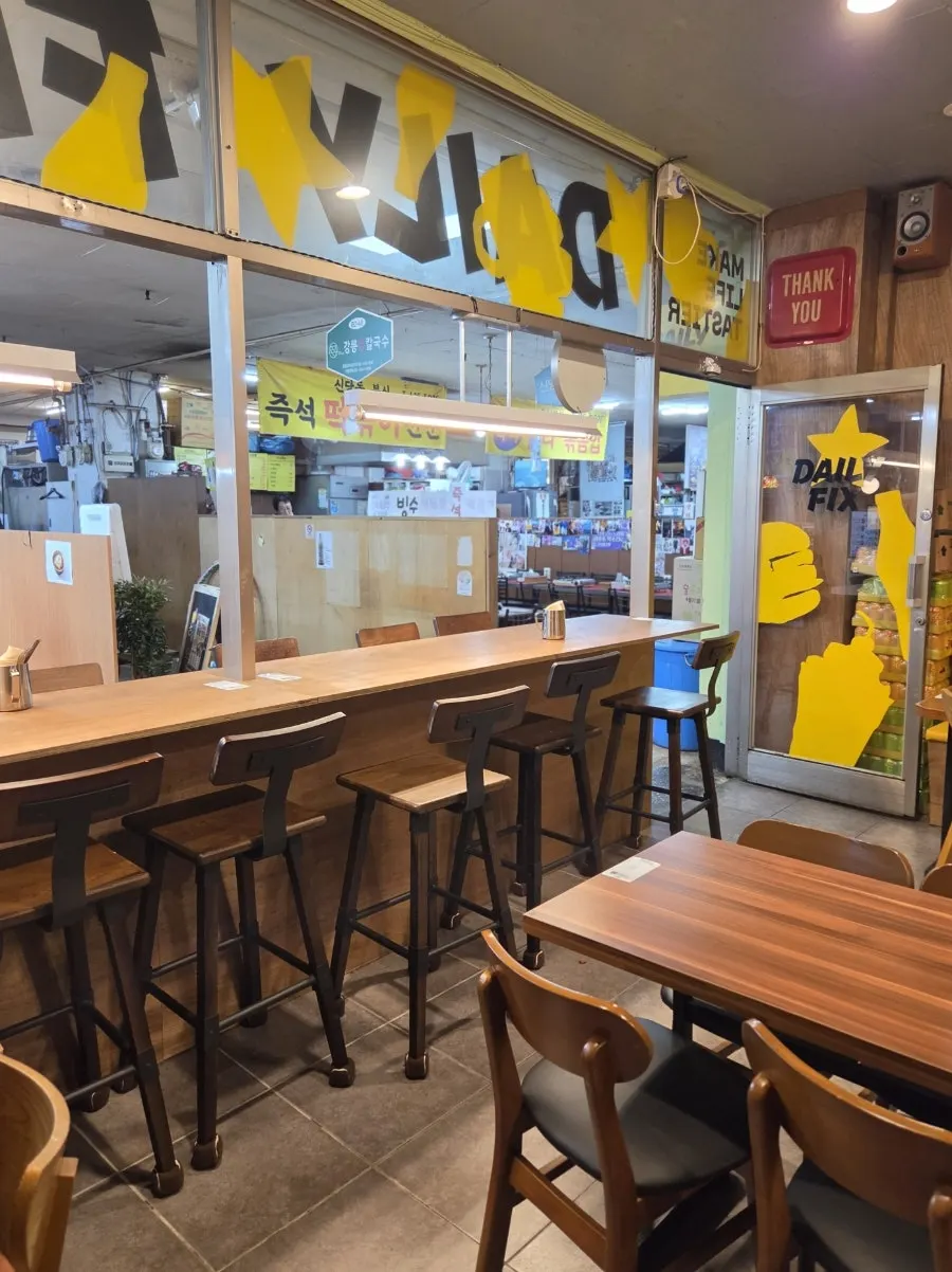 Interior of Daily Fix, mixing yellow tones with wood