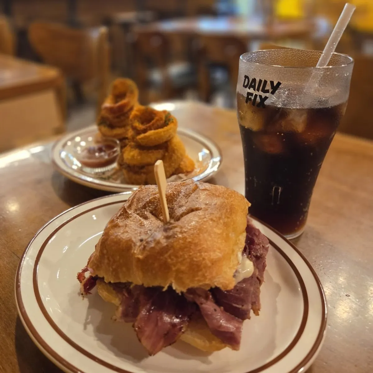 A plate with the daily 15-only pastrami sandwich