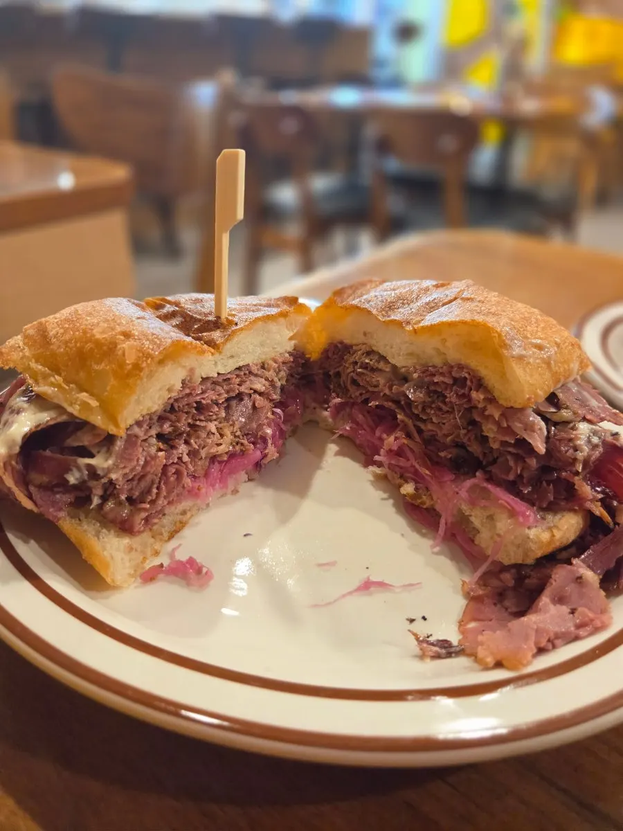 Pickled cabbage layered inside the pastrami sandwich