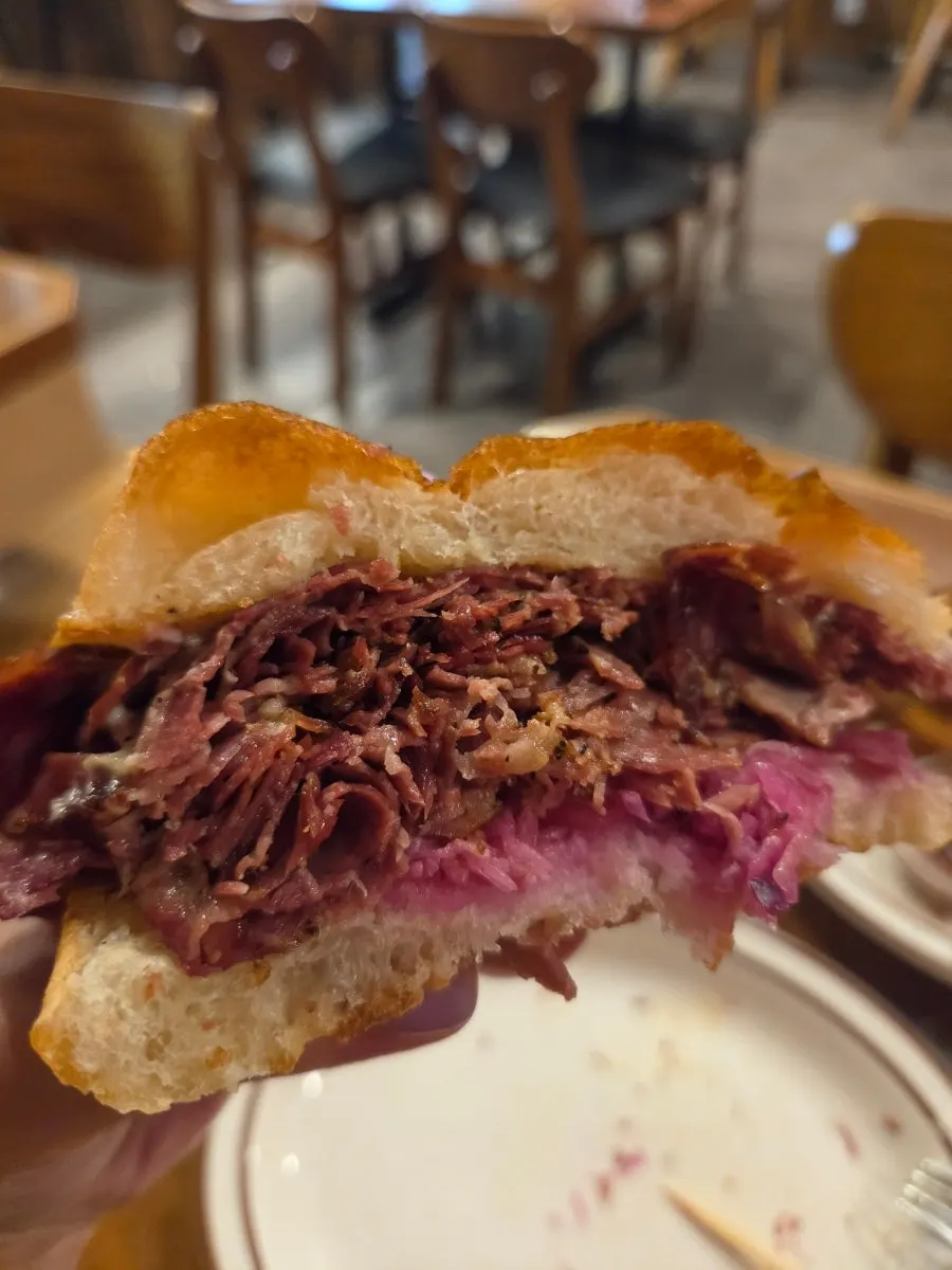 The pastrami sandwich, too big to hold in one hand
