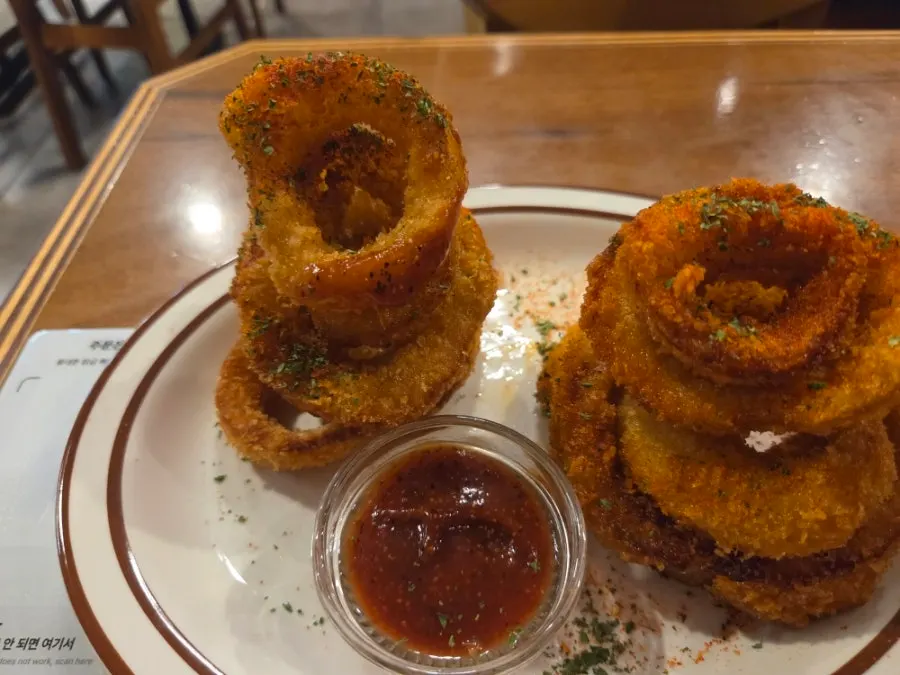 Onion rings served with hot ketchup sauce