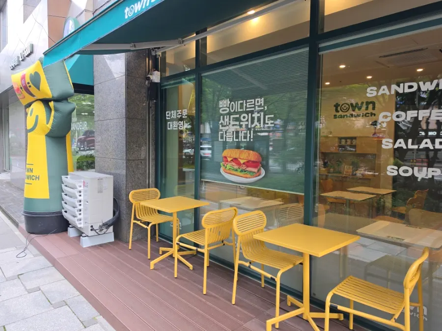 Wood-tone interior of Town Sandwich Jamsil Branch