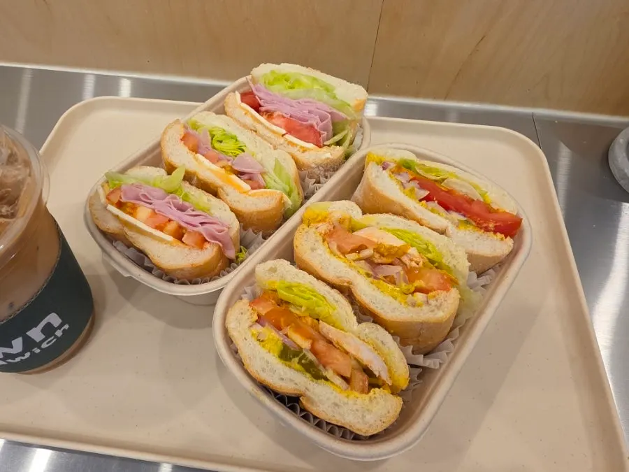 Cross-section of the Town Sandwich with jambon-beurre, cheese, and vegetables