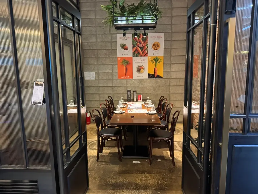 Restaurant interior with chandeliers and plants