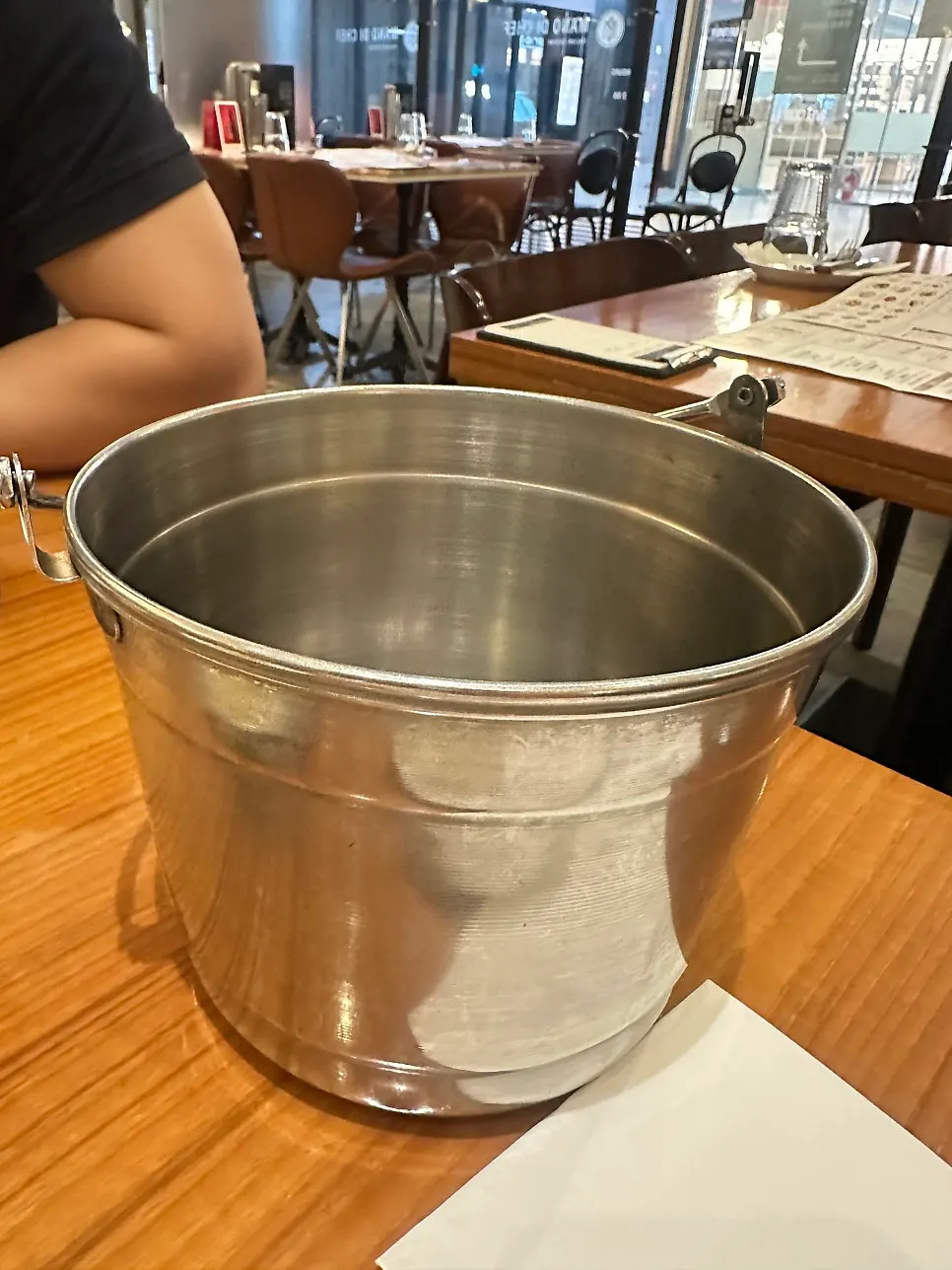 Table with a bowl for seafood shells