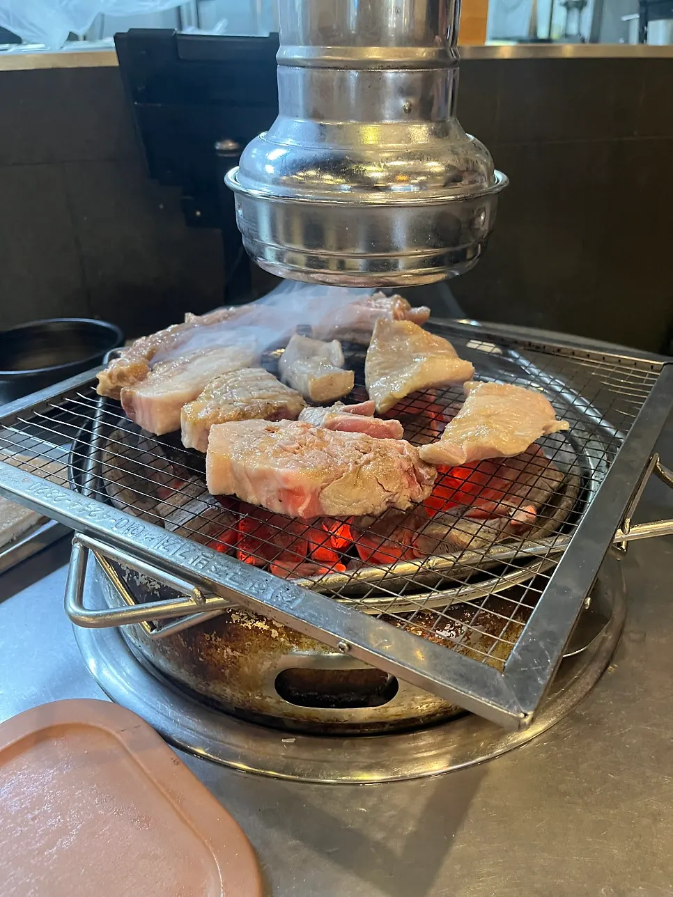 Seared meat placed on the grill