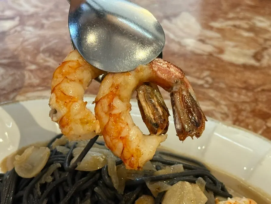 Close-up of red shrimp aglio e olio pasta