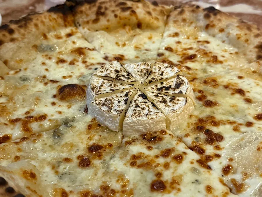Freshly baked Gorgonzola Camembert pizza