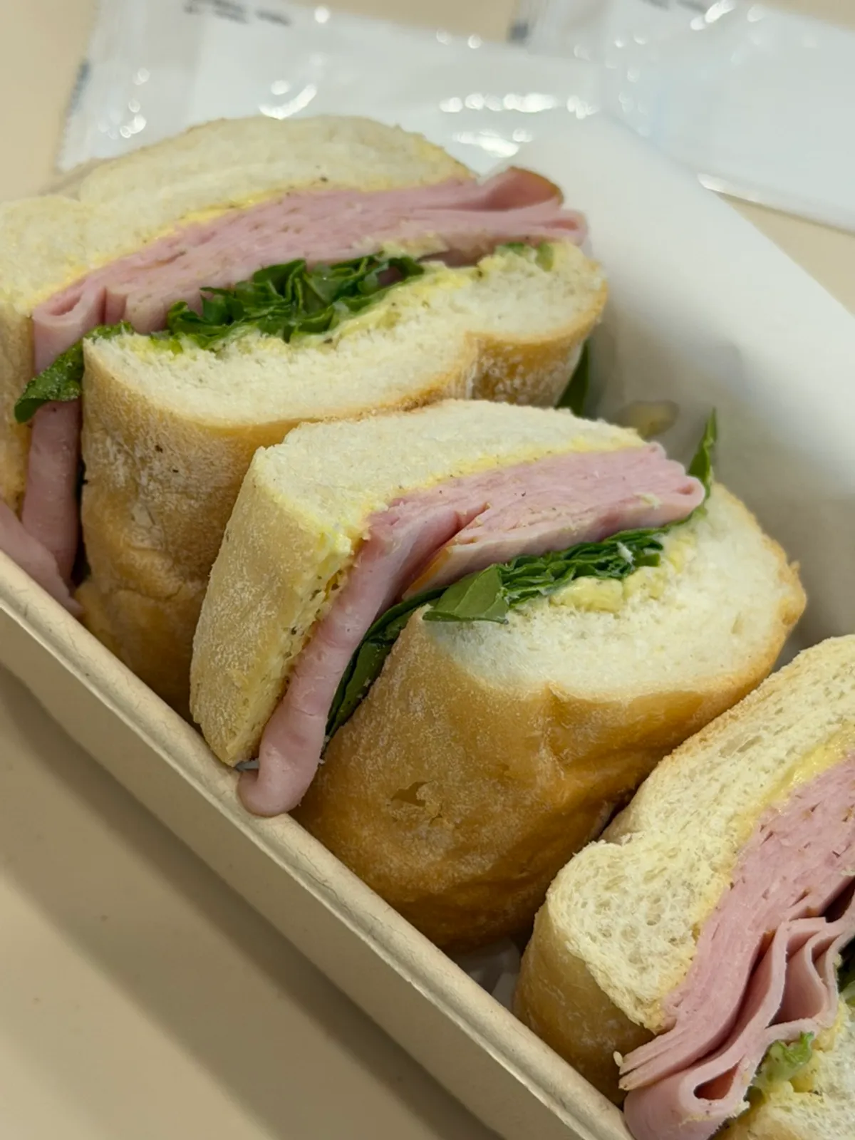 Truffle jambon sandwich cut into thirds