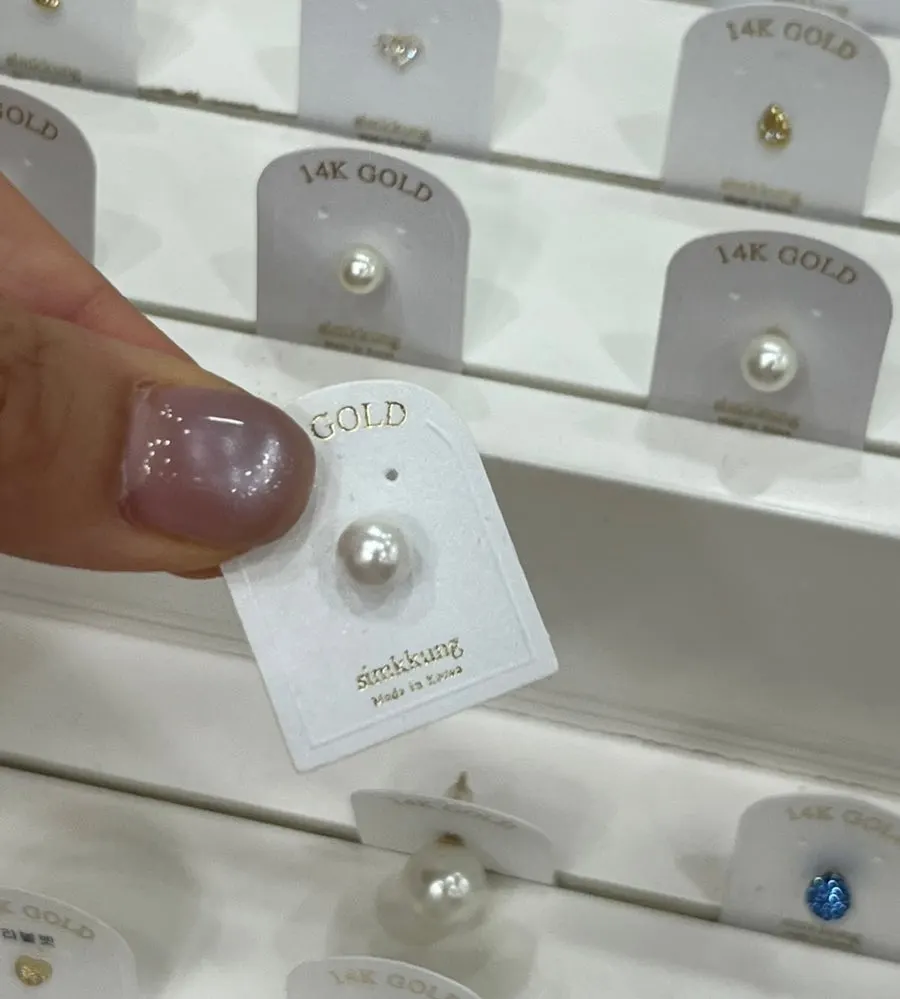 14k piercings with cubic and pearl designs