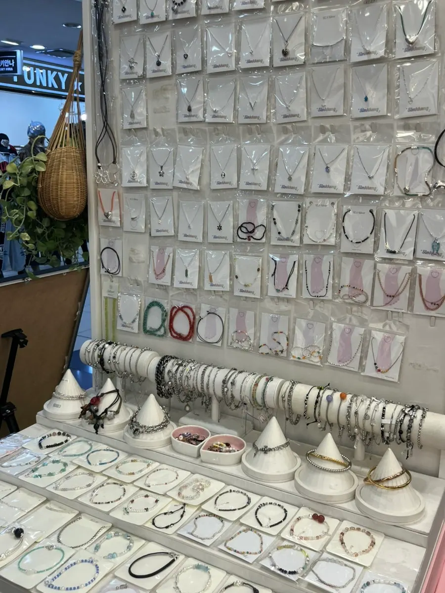 Accessory display with necklaces hanging