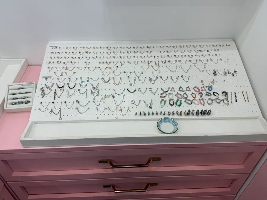 Display of industrial-style through-piercings