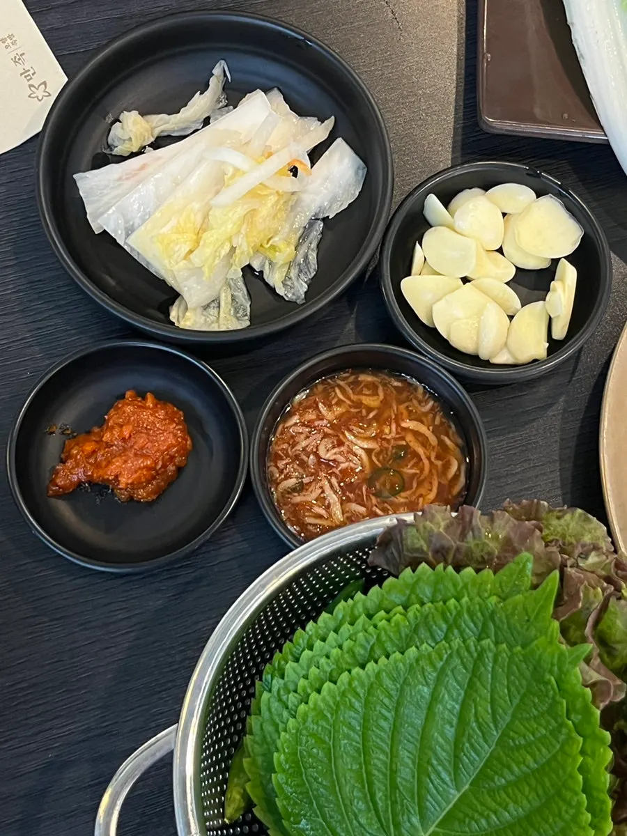 Table of side dishes served with the bossam