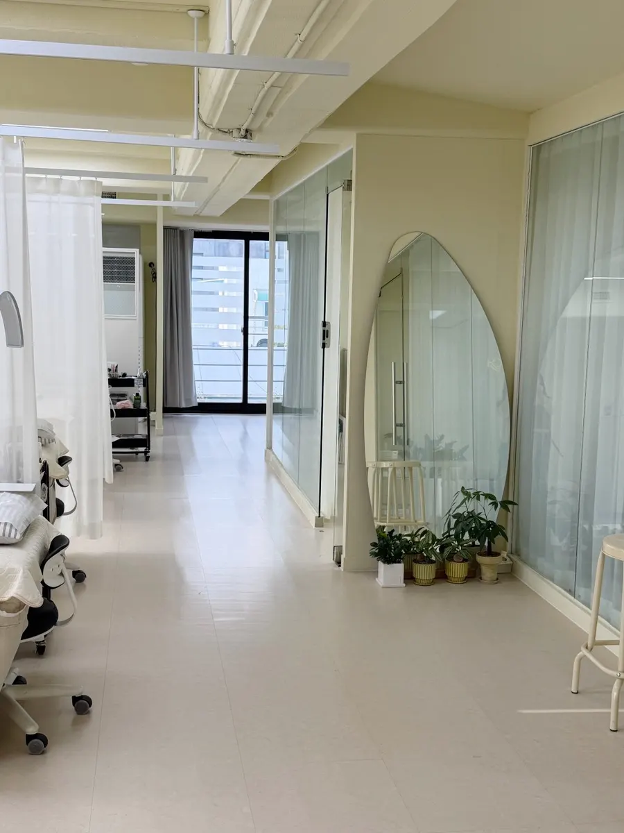 Treatment bed separated by curtains