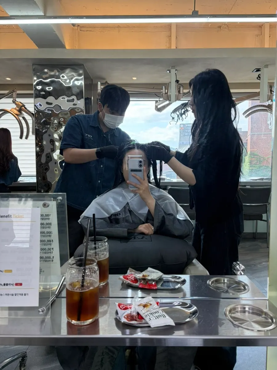 Hair after the scalp-specific shampoo, right before the root perm begins