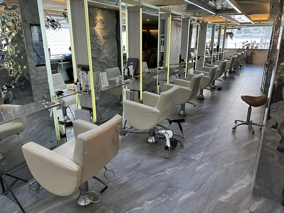 Salon treatment area with generously spaced seating