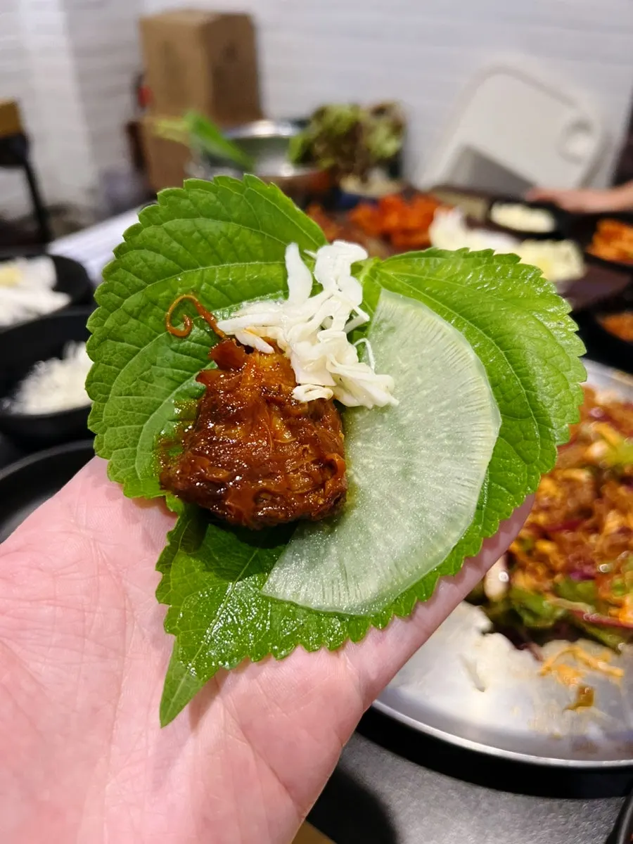 Charcoal jokbal meat pulling apart along the grain
