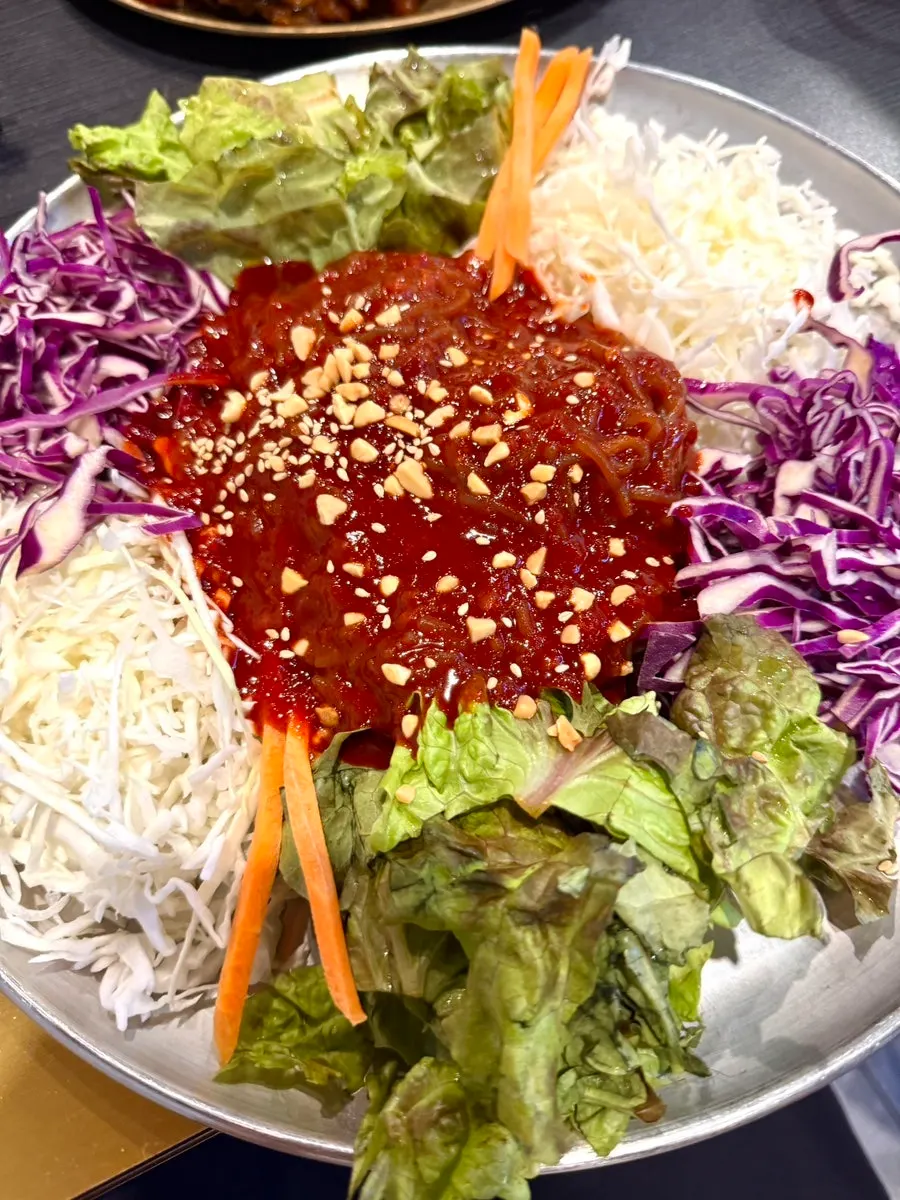 Jaengban guksu piled with vegetables