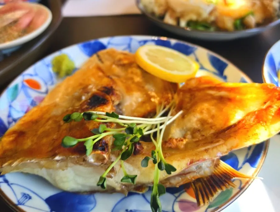 Close-up of the crispy-skinned grilled sea bream head