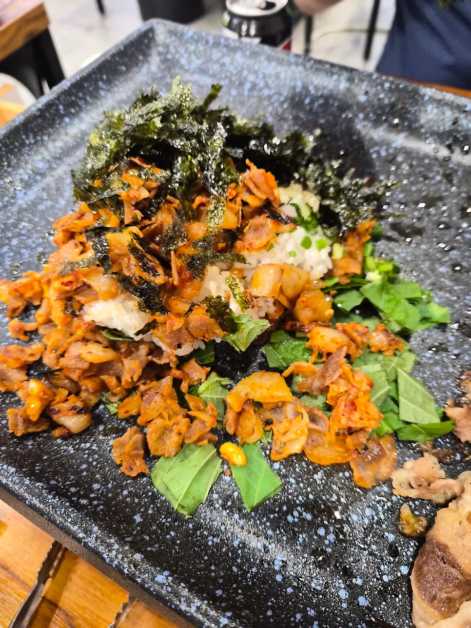 Self-serve fried rice being made from chopped leftover ingredients