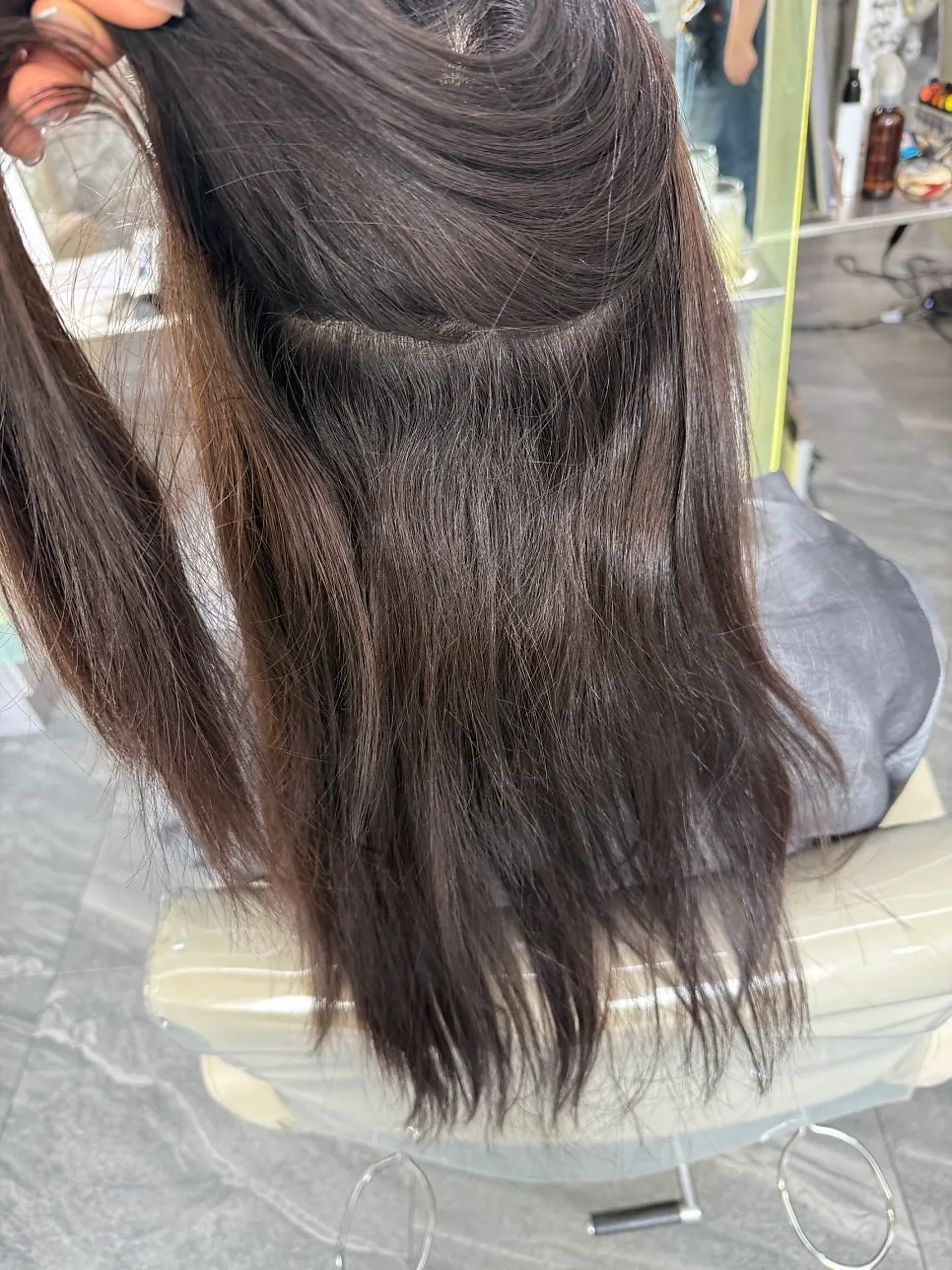 Hair condition before treatment, with curly roots coming in