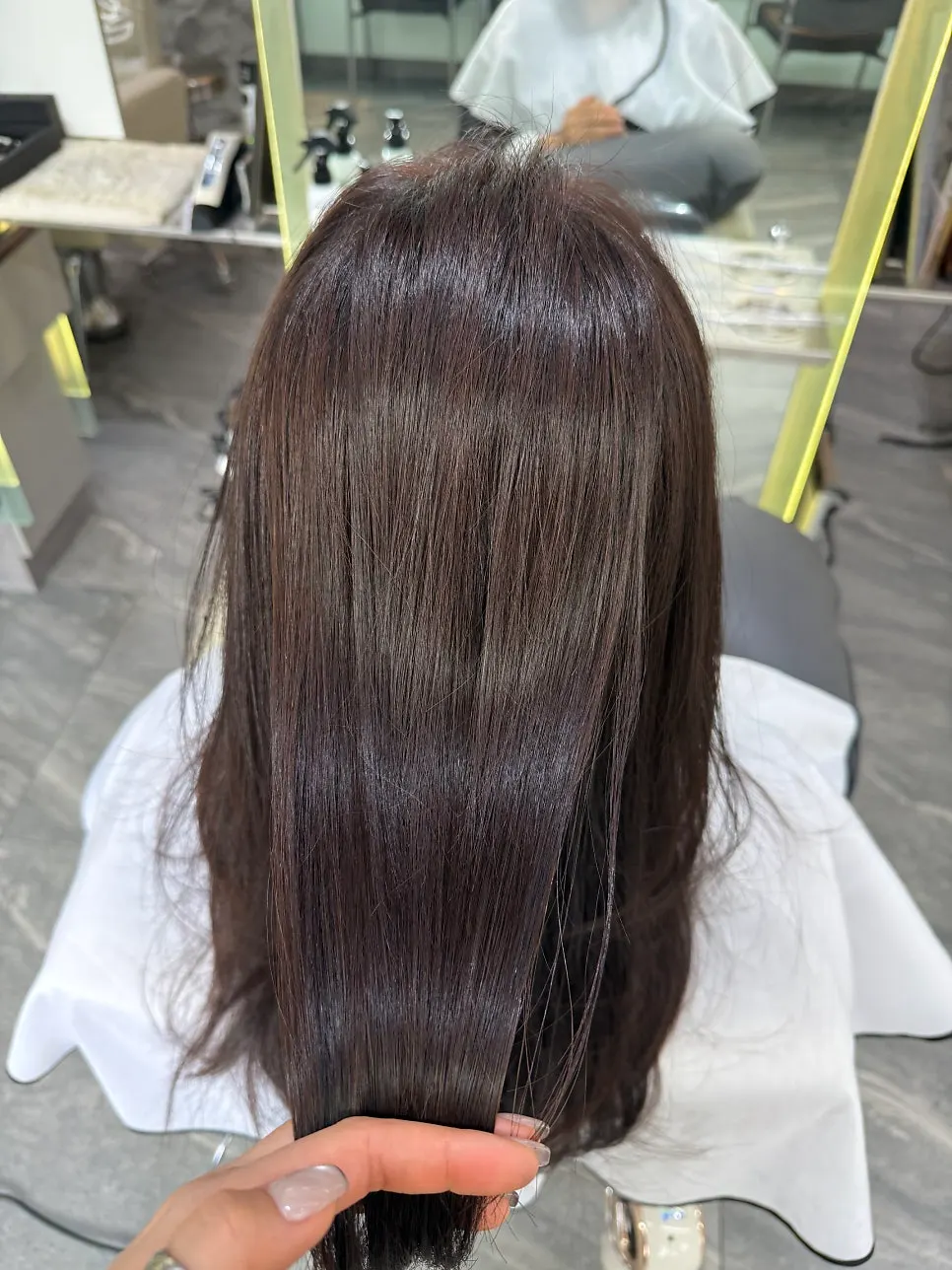 Roots straightened smoothly with glossy, softened hair